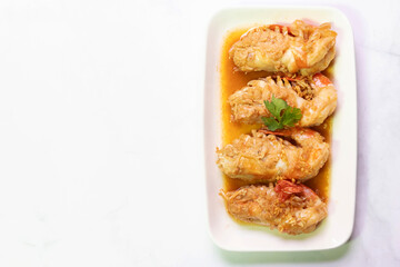 Garlic shrimp stir-fry on white plate; easy and delicious menu.