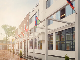 Facade of the school building with flags outdoors