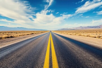 Naklejka premium Desert Highway Stretch Road trip under blue skies with mountain backdrop