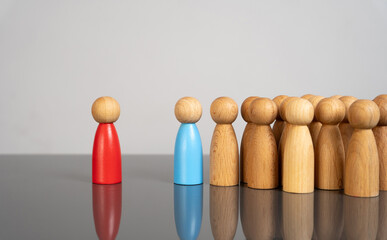 The blue man leads the people against the red man. The concept of supporting the majority against...