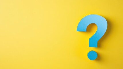 A yellow and blue question mark is on a yellow background The question mark is made of paper and is cut out