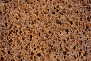 The texture of black bread. Black bread texture pattern. Bread background.