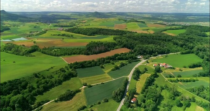 Enjoying scenic countryside views with lush fields and winding roads in a serene landscape