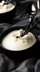 A Refined Vanilla Bean Dessert, Exquisitely Presented in a Black Bowl. A Culinary Masterpiece