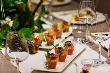 Exquisite gourmet salmon tartare appetizers elegantly presented in clear cups