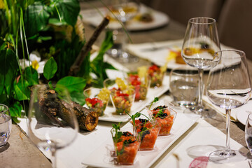 Exquisite gourmet salmon tartare appetizers elegantly presented in clear cups