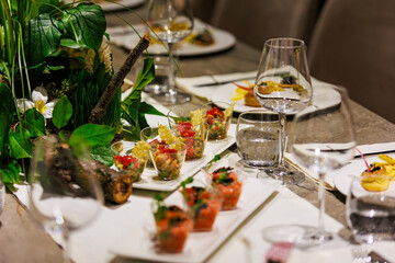 Exquisite gourmet salmon tartare appetizers elegantly presented in clear cups