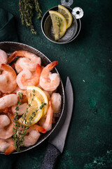 Frozen uncooked prawns or shrimps with lemon