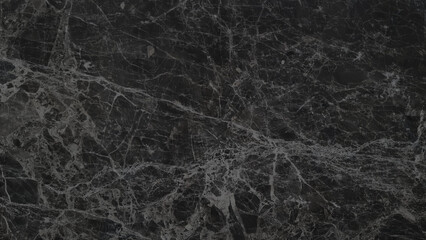 close-up view of a black emperador marble surface with a captivating pattern of intricate grey veins and subtle variations in shade, creating a visually rich and textural background ideal for design.