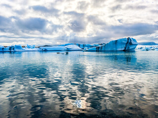 South Iceland, Diamond Beach. Beach with sparkling icebergs at sunset.