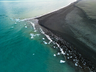 South Iceland, Diamond Beach. Beach with sparkling icebergs at sunset.