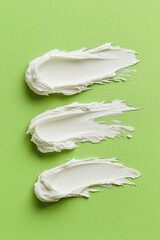 Layers of creamy texture artfully sprawled across a vibrant green background in an abstract culinary delight