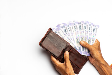 Close-up of Counting Indian rupee isolated on white background 