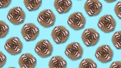 easter chocolate eggs in nest. full blue easter egg background. chocolate easter egg pattern.