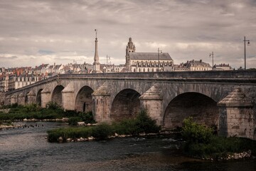Obraz premium Old bridge over the river in Blois city, Loire valley France