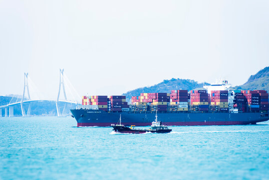 Busan, South Korea - large cargo container ship CHRISTA SCHULTE sailing near the Korean coast on her international trading route. 