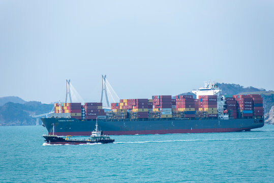 Busan, South Korea - large cargo container ship CHRISTA SCHULTE sailing near the Korean coast on her international trading route. 