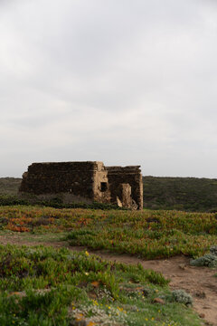 ncient Stone Ruins in Green Landscape under Cloudy Sky