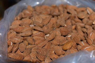 Almonds nestled in a clear bag, showcasing their natural texture and earthy tones