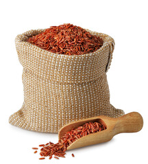 Red rice in a sack and wooden scoop isolated on white background