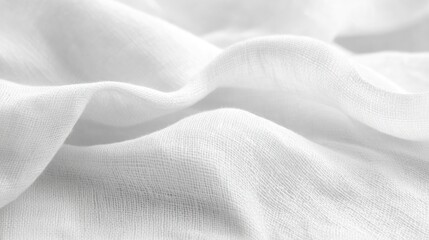 Obraz premium Close-up of soft, white fabric with gentle folds and wrinkles, showing texture and drape.