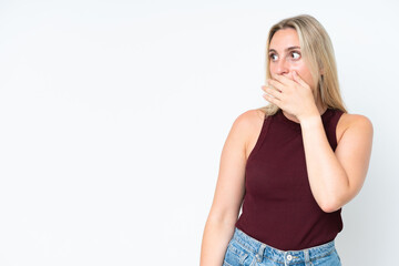 Young caucasian woman isolated on white background doing surprise gesture while looking to the side