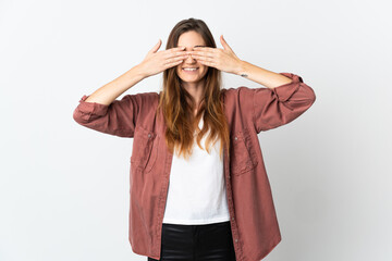Young Ireland woman isolated on white background covering eyes by hands and smiling