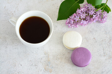 Coffee, macarons and lilacs perfect morning treat