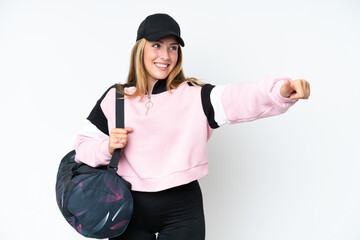 Young sport caucasian woman with sport bag isolated on white background giving a thumbs up gesture