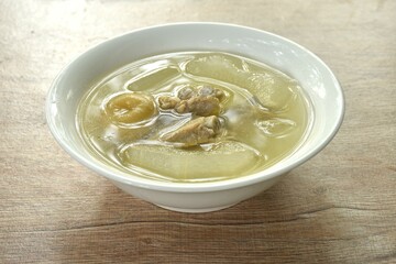 boiled winter melon pork bone with pickled lemon in clear soup on bowl