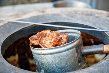 Preparing of Uzbek Samsa or Sambousak oriental meal stuffed with meat, cheese or vegetables at...