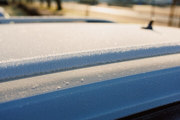 The top surface of a car is currently covered in a layer of frost