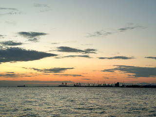 Seascape at sunset in Thessaloniki, Greece, with a view of the port.