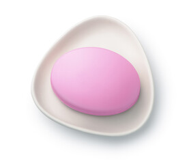 Pink soap bar in ceramic soap dish