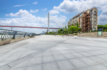 Empty square floor and buildings with bridge in Shanghai at daytime
