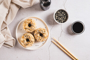 Spicy rice and beef donuts on a plate on the table top view