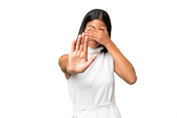 Young African american woman over isolated background making stop gesture and covering face