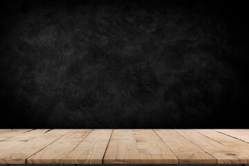 Wooden table in dark room background concept for advertising.