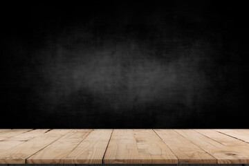 Wooden table in dark room background concept for advertising.