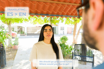 AR glasses enabling real-time language translation between spanish-speaking woman and english-speaking man