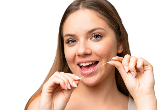 Young blonde woman over isolated chroma key background using dental floss with happy expression. Close up portrait