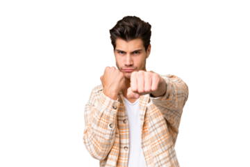 Young handsome caucasian man over isolated background with fighting gesture