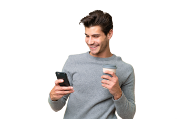 Young handsome caucasian man over isolated background holding coffee to take away and a mobile