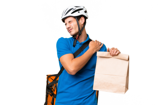 Young caucasian man taking a bag of takeaway food over isolated background suffering from pain in shoulder for having made an effort - Powered by Adobe