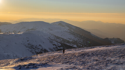 Beautiful sunset in the Slovak Tatras in winter. Low Tatras covered with snow.