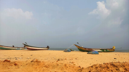 boats on the shore of Pazhaverkady beach, Tamil Nadu, India