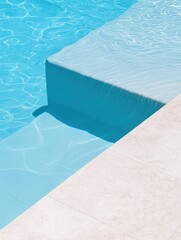 Obraz premium Rectangular swimming pool with clear blue water. the water is rippled and has a smooth surface. on the right side of the image, there is a white concrete edge that extends into the pool.