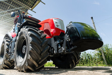 Red tractor on a farm using renewable energy