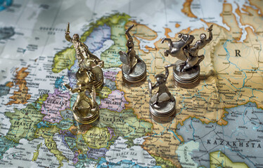 The children warrior pawns fight a battle on the world map. War between Russia and Ukraine