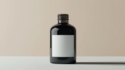 A sleek black bottle with a blank label set against a minimalist background, ideal for product packaging mockups